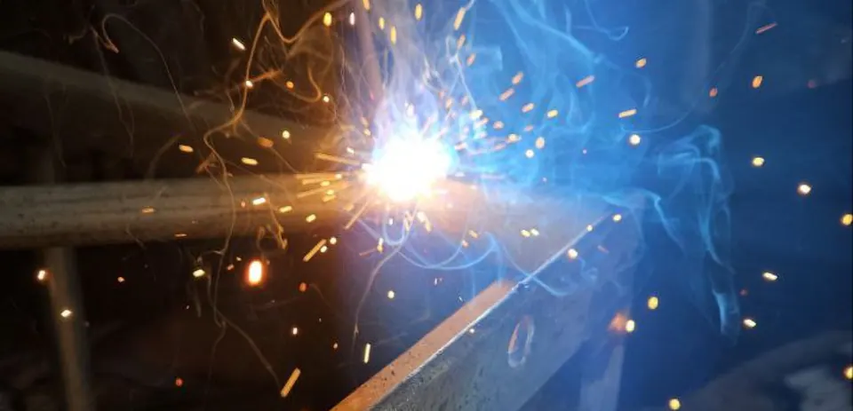 Welder working with sparks flying